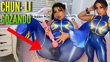 Super-sexy costume play woman clothed as Chun Li from street fighter playing with her htachi electro-hitachi cumming and dousing her underpants and trousers ahegao