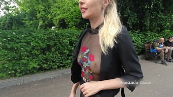 Public walk in semi-transparent t-shirt in tip hour